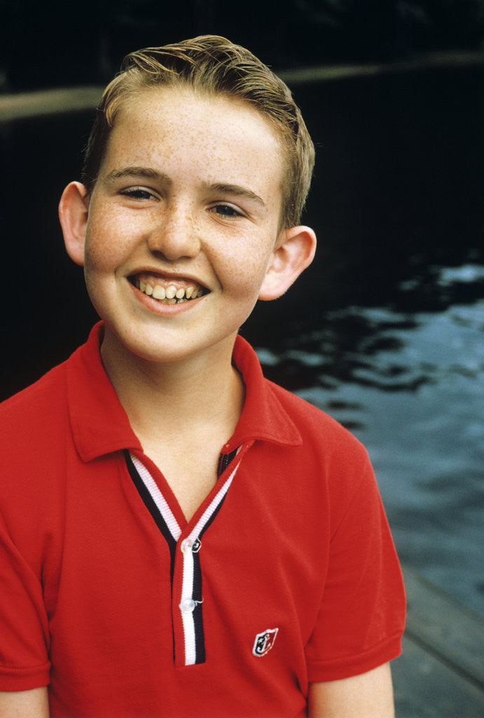 Detail of Portrait young boy in red shirt smiling by Anonymous