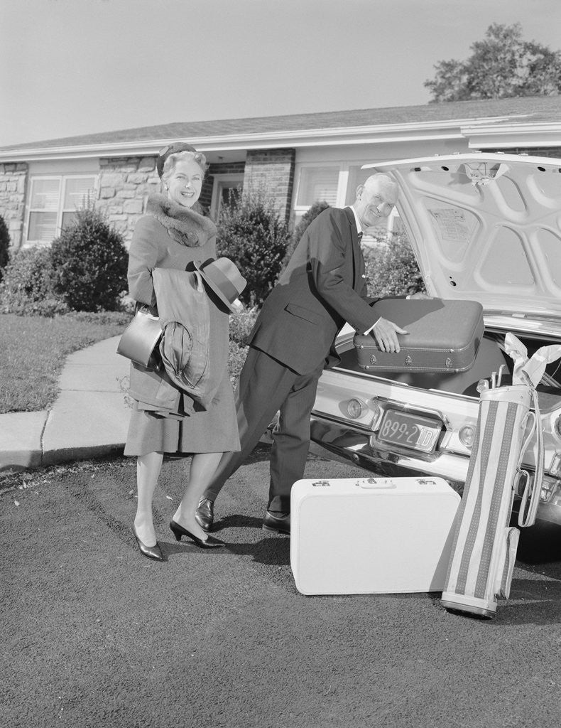 Detail of Senior man woman husband wife packing trunk with luggage by Anonymous