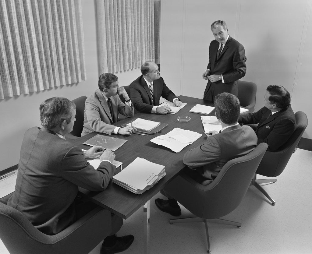 Detail of 6 executive businessmen around conference table board meeting by Anonymous