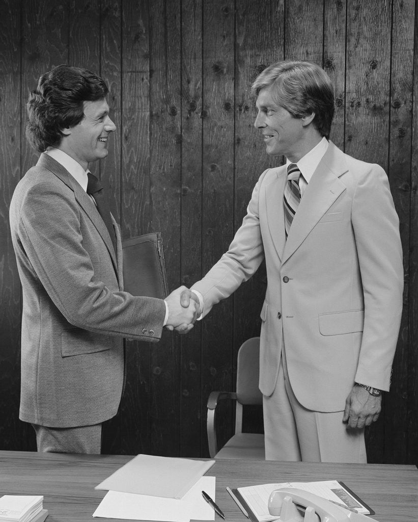 Detail of Two businessmen shaking hands handshake by Anonymous