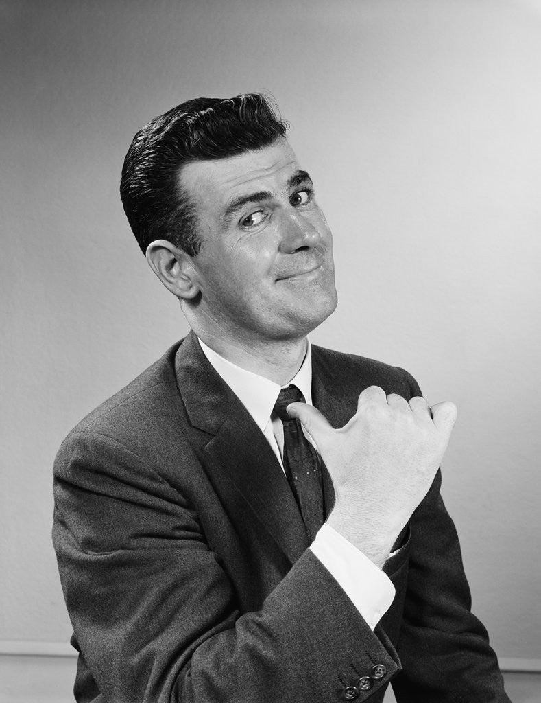 Detail of Business man smiling giving thumbs up sign pointing to himself by Anonymous