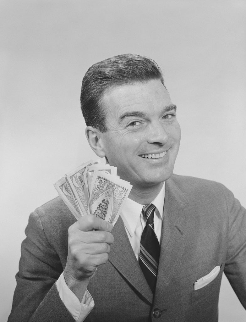Detail of Smiling man holding a fistful of money fake bills by Anonymous