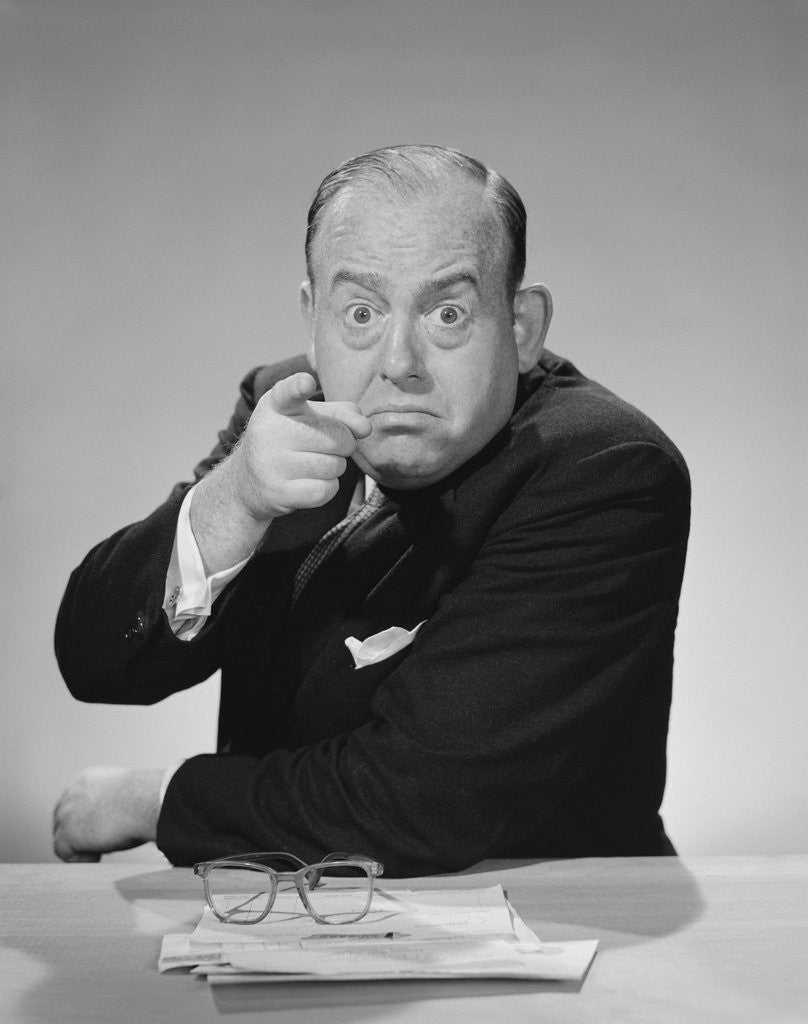 Detail of Angry businessman pointing finger bulging staring eyes wide open by Anonymous