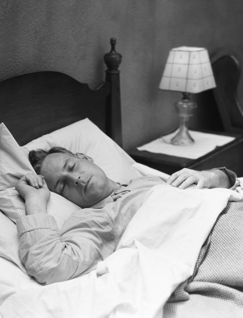 Detail of Man sleeping asleep in bedroom by Anonymous