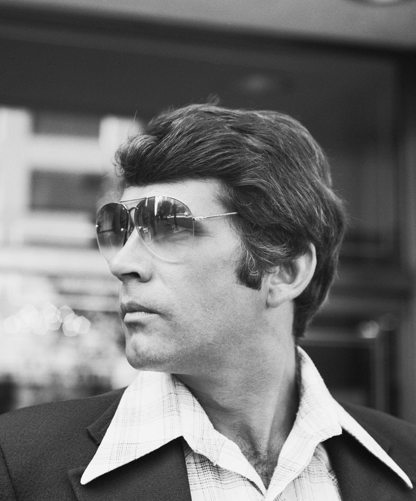 Detail of Portrait profile man wearing aviator sunglasses by Anonymous