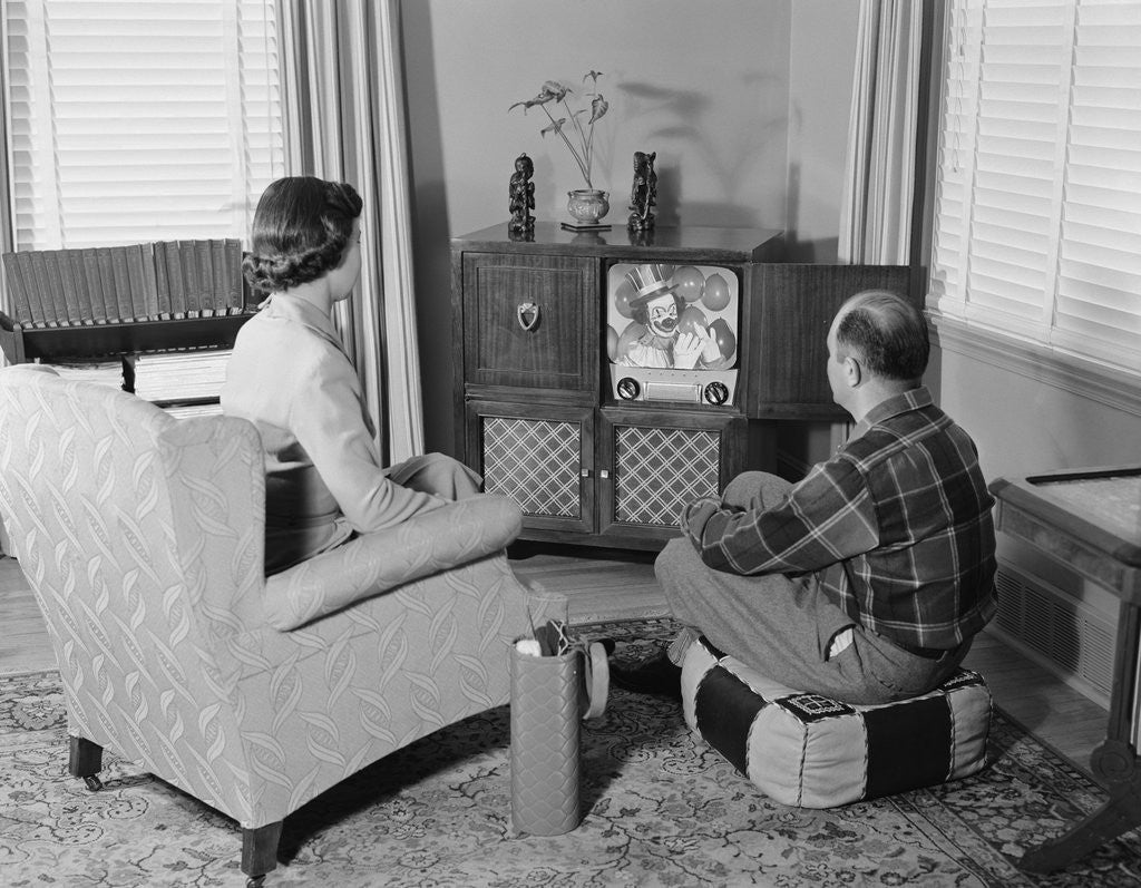 Detail of Couple husband wife watching console television in living room by Anonymous