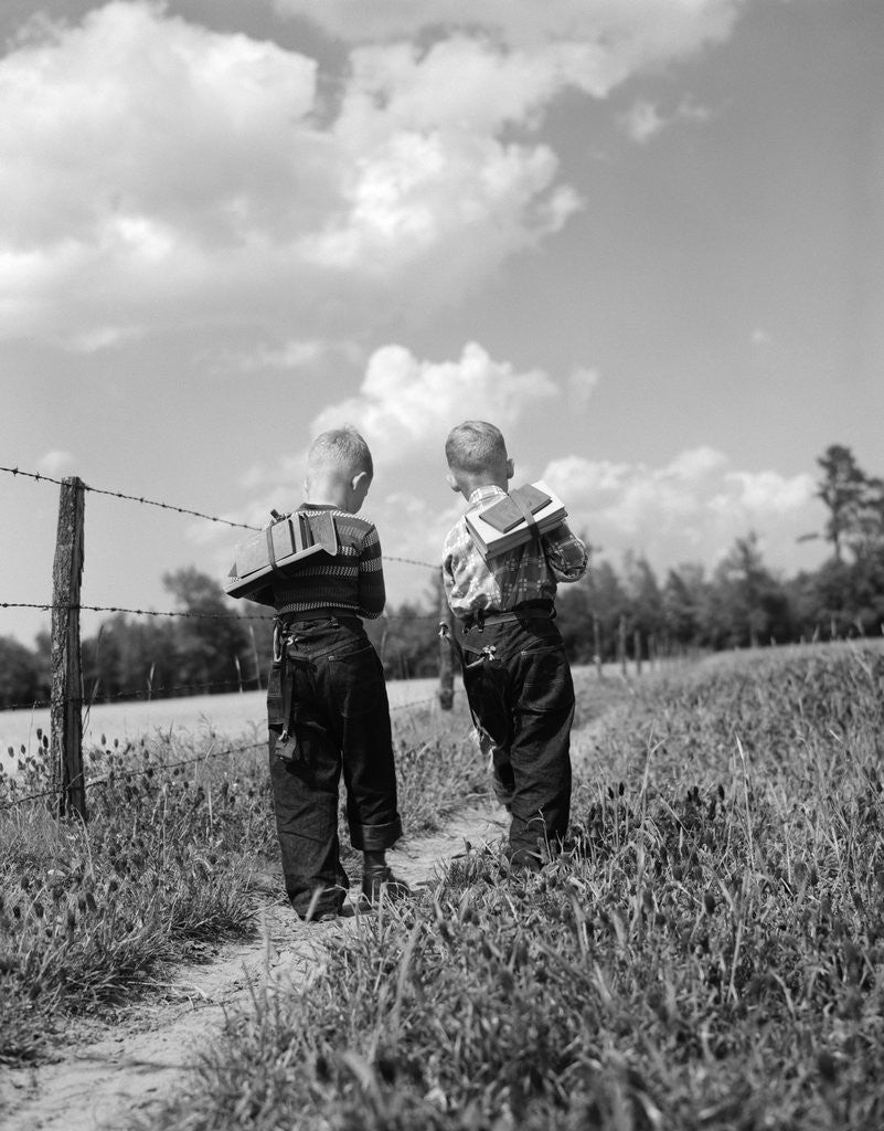 Detail of Back view 2 boys with book packs walking to from school by Anonymous
