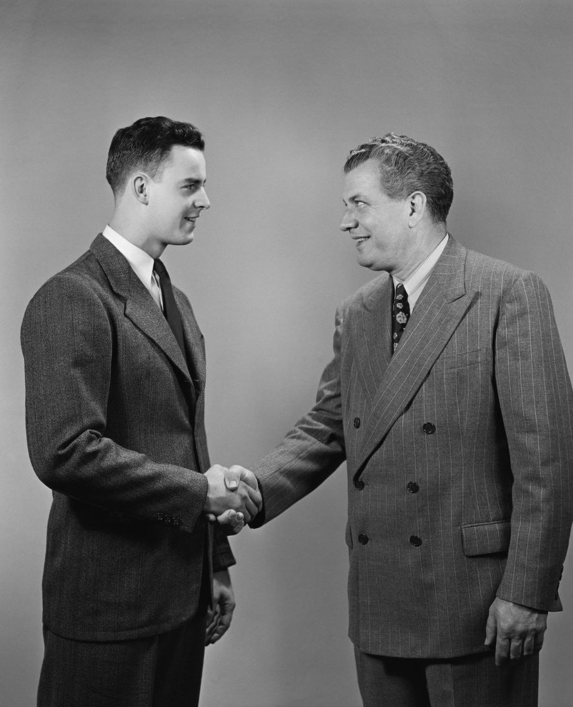 Detail of Two business men of different generations shaking hands by Anonymous