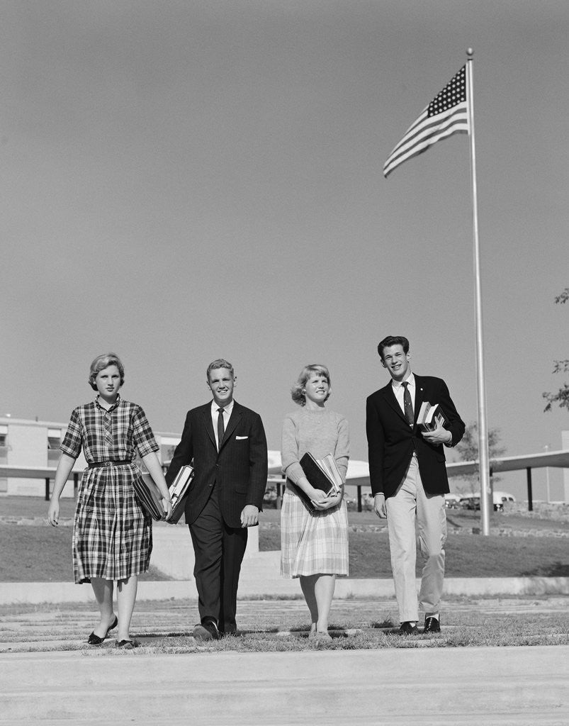 Detail of Group 4 high school students walking past american flag carrying textbooks by Anonymous