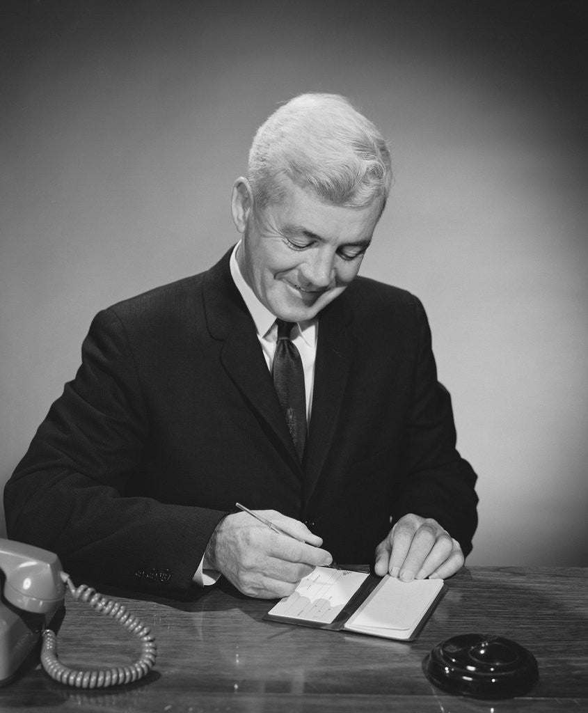 Detail of Man writing check from checkbook by Anonymous