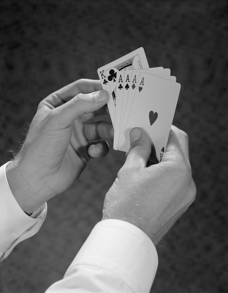 Detail of Male hands holding hand poker cards 4 aces and a king by Anonymous