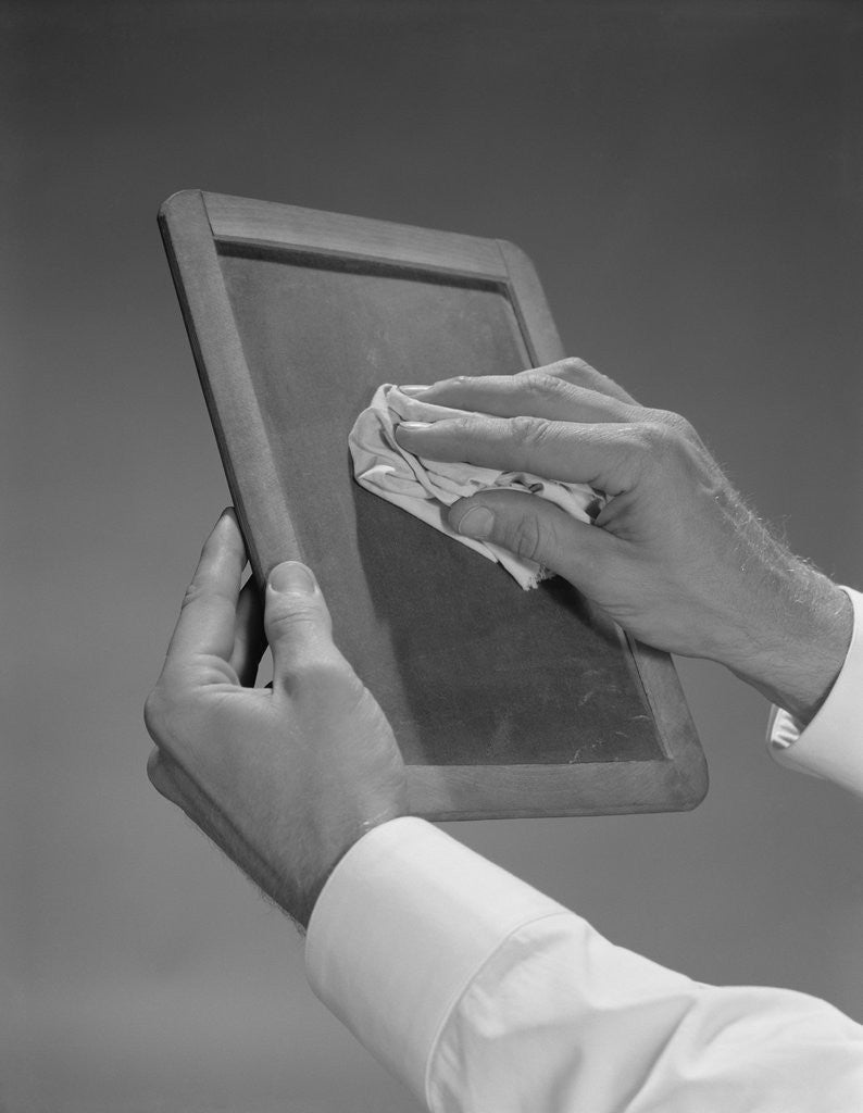 Detail of Male hands wiping slate clean by Anonymous