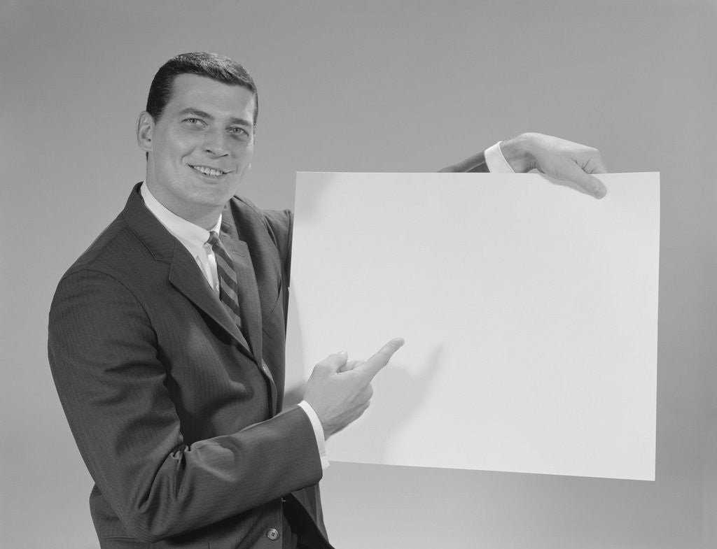 Detail of Smiling man pointing to blank poster by Anonymous