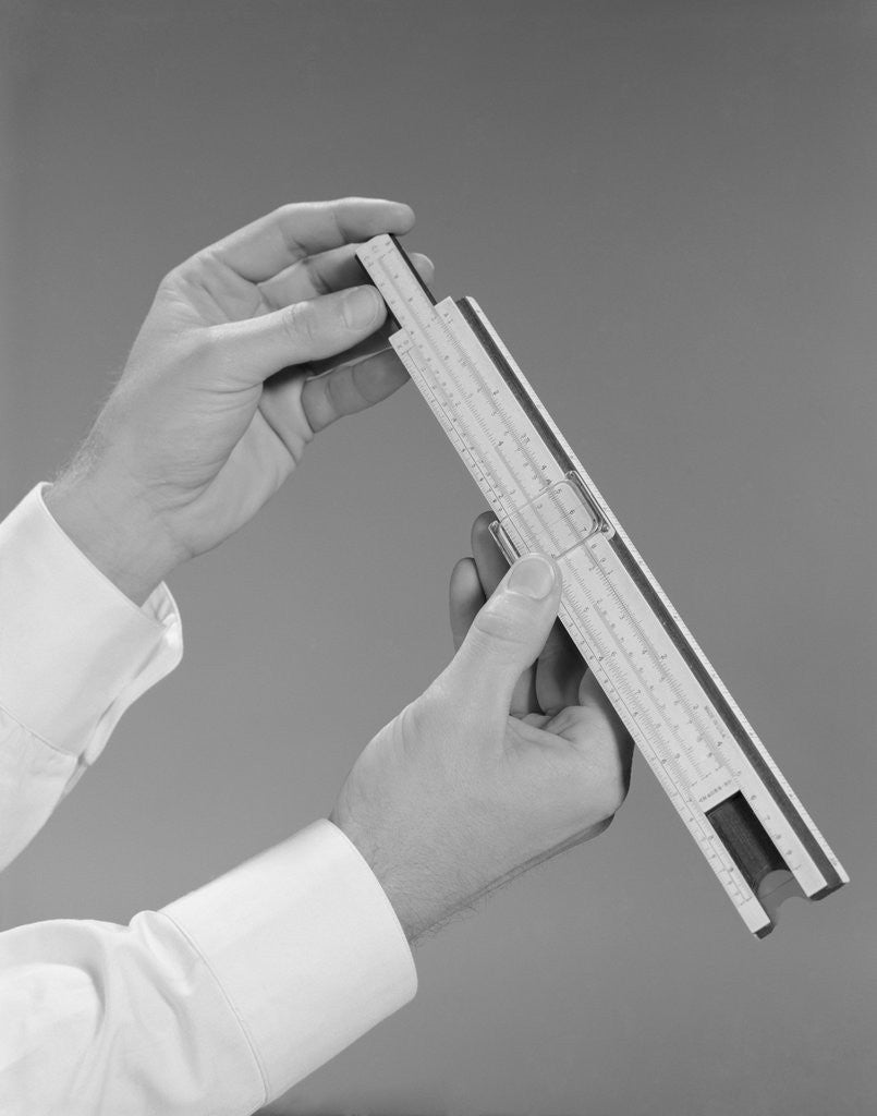 Detail of Male hands holding a slide rule measure by Anonymous