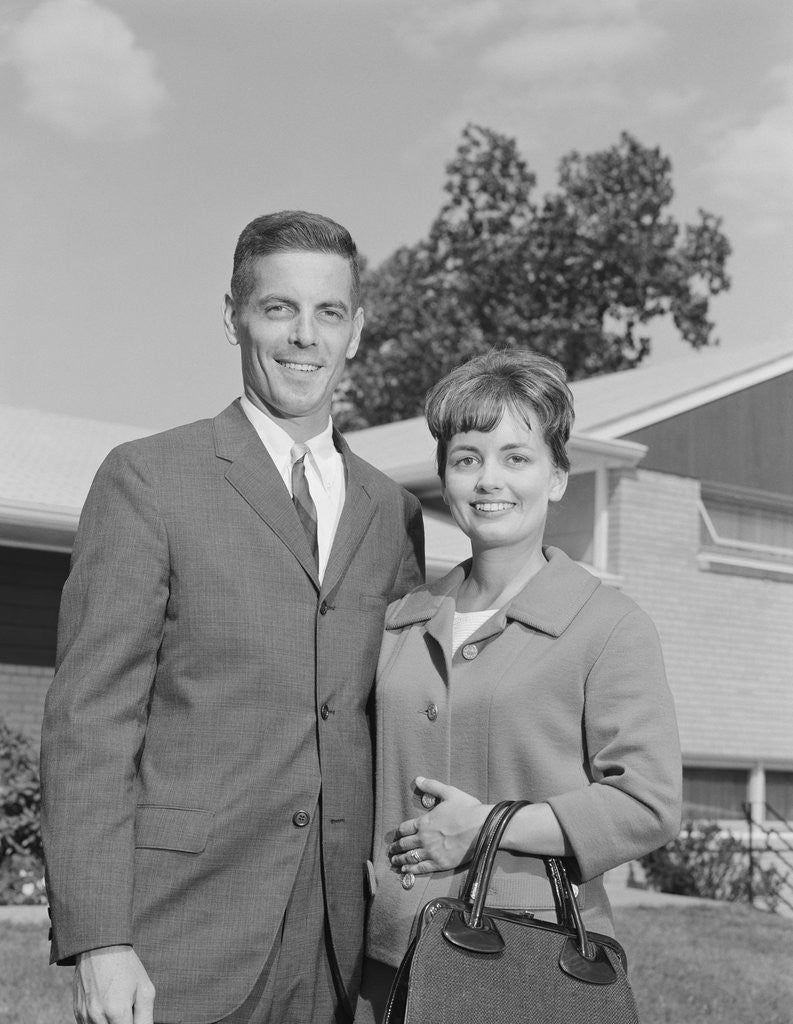 Detail of Portrait smiling couple in front of suburban house by Anonymous