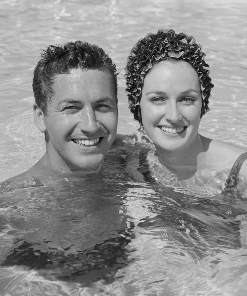Detail of Smiling couple man woman in swimming pool by Anonymous