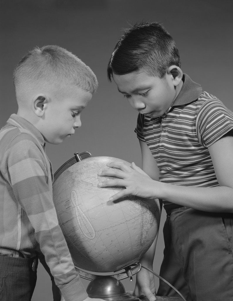 Detail of Two boys studying earth globe by Anonymous