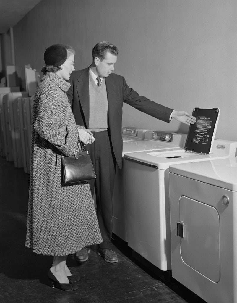 Detail of Young couple man woman shopping for washing machine by Anonymous