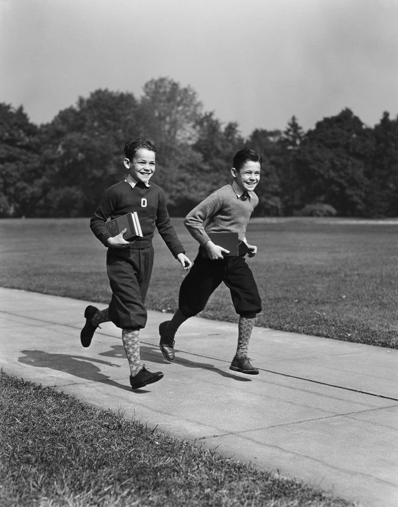 Detail of Two smiling boys running carrying school books by Anonymous