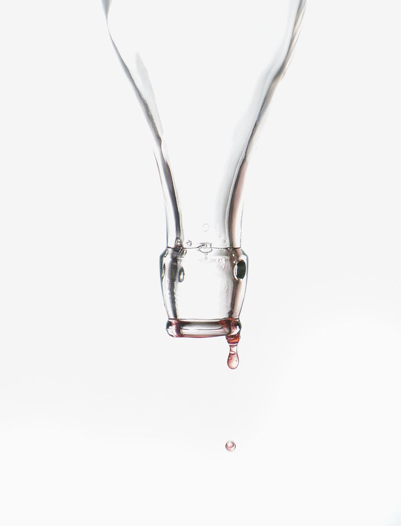 Detail of Liquid pouring out of empty bottle by Anonymous