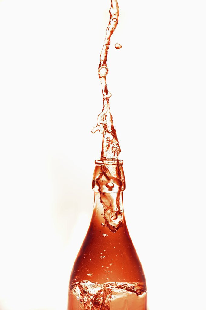 Liquid pouring out of water bottle by Corbis