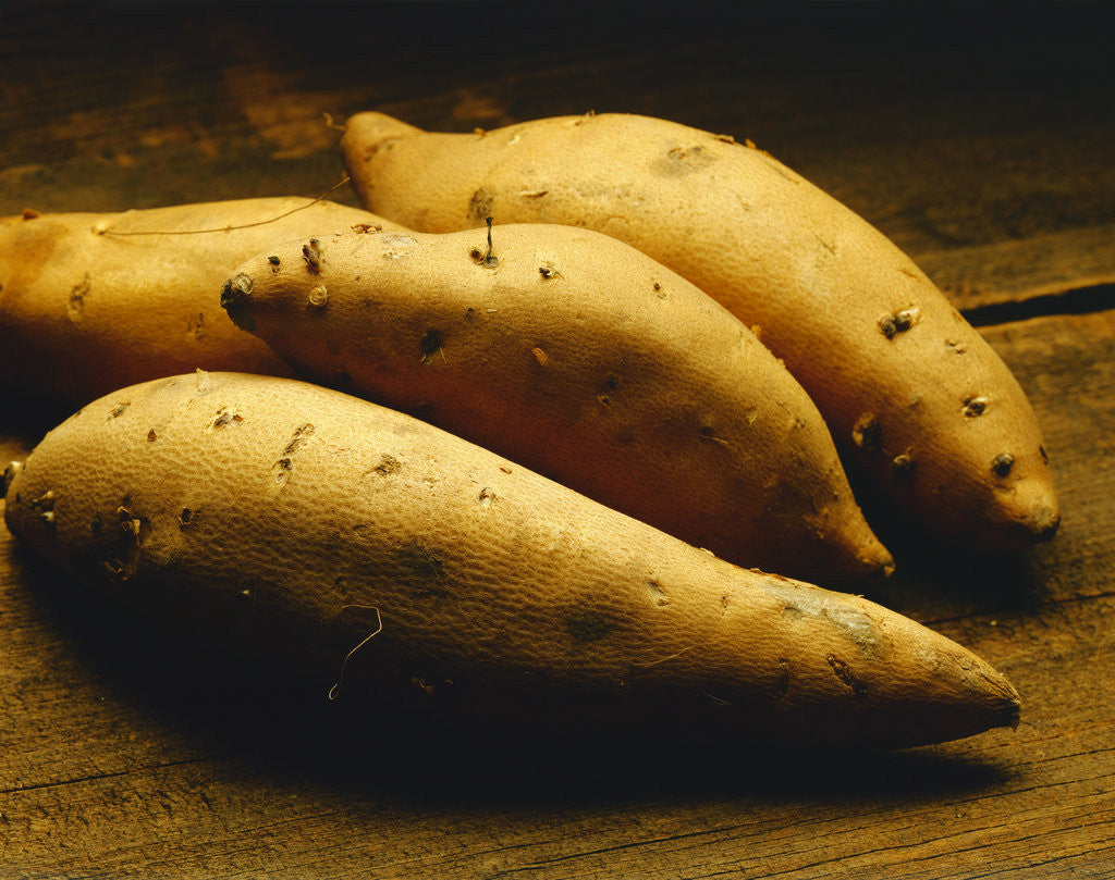 Detail of Yams on Wooden Table by Anonymous