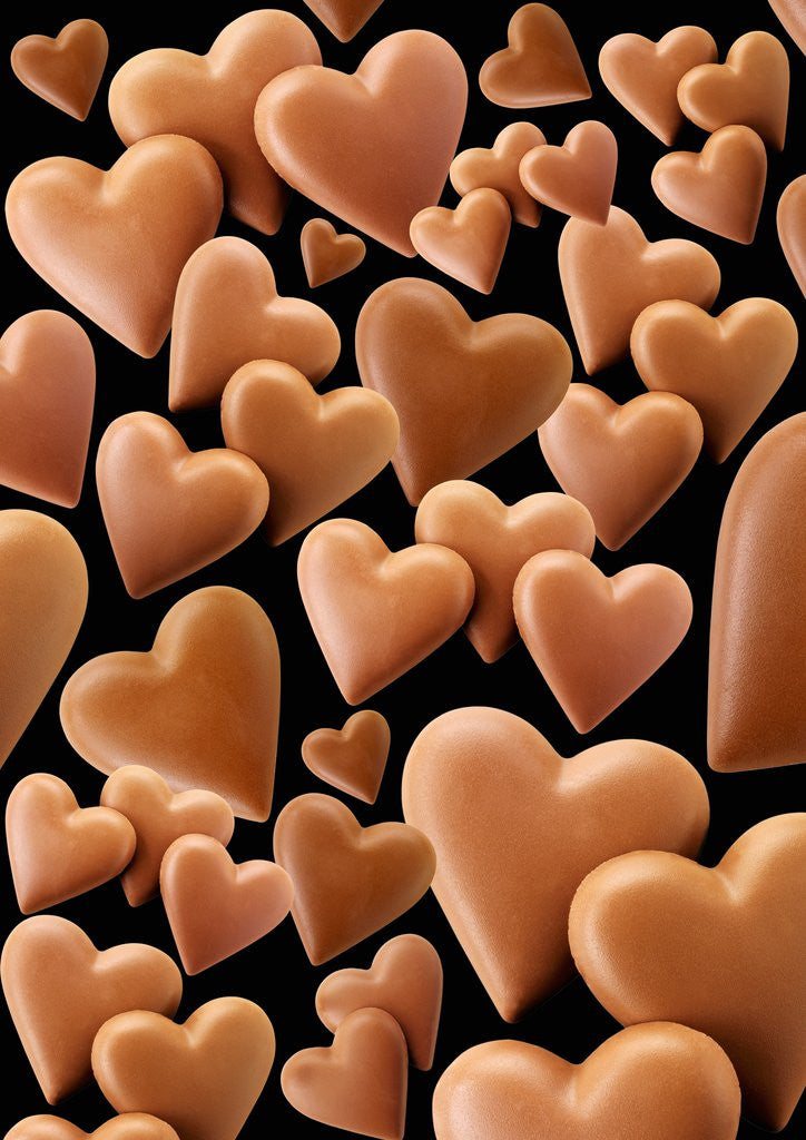 Chocolate hearts, black background by Corbis
