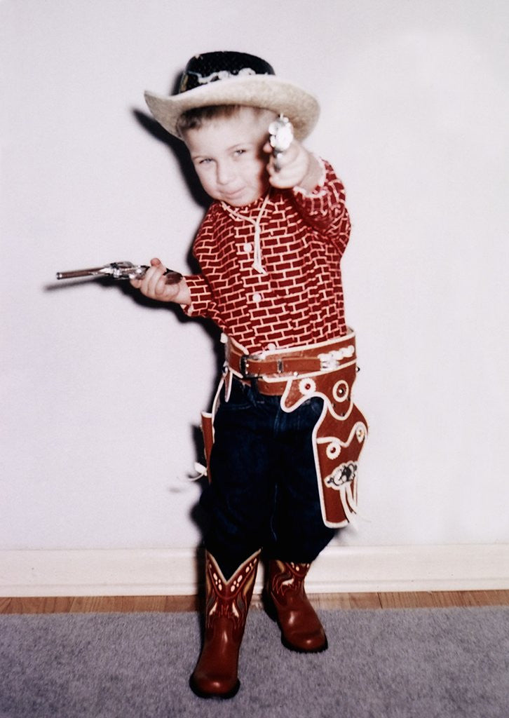 Detail of Little cowboy fires play six shooters, ca. 1956 by Anonymous