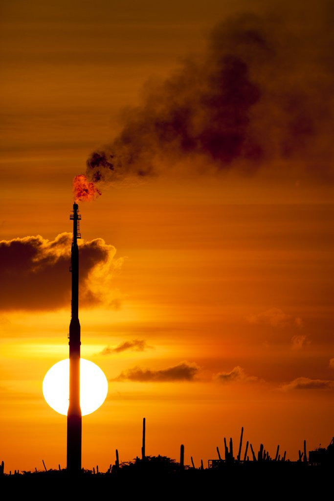 Detail of Flames and smoke billow from natural gas flare at Valero Oil Refinery at sunset by Anonymous