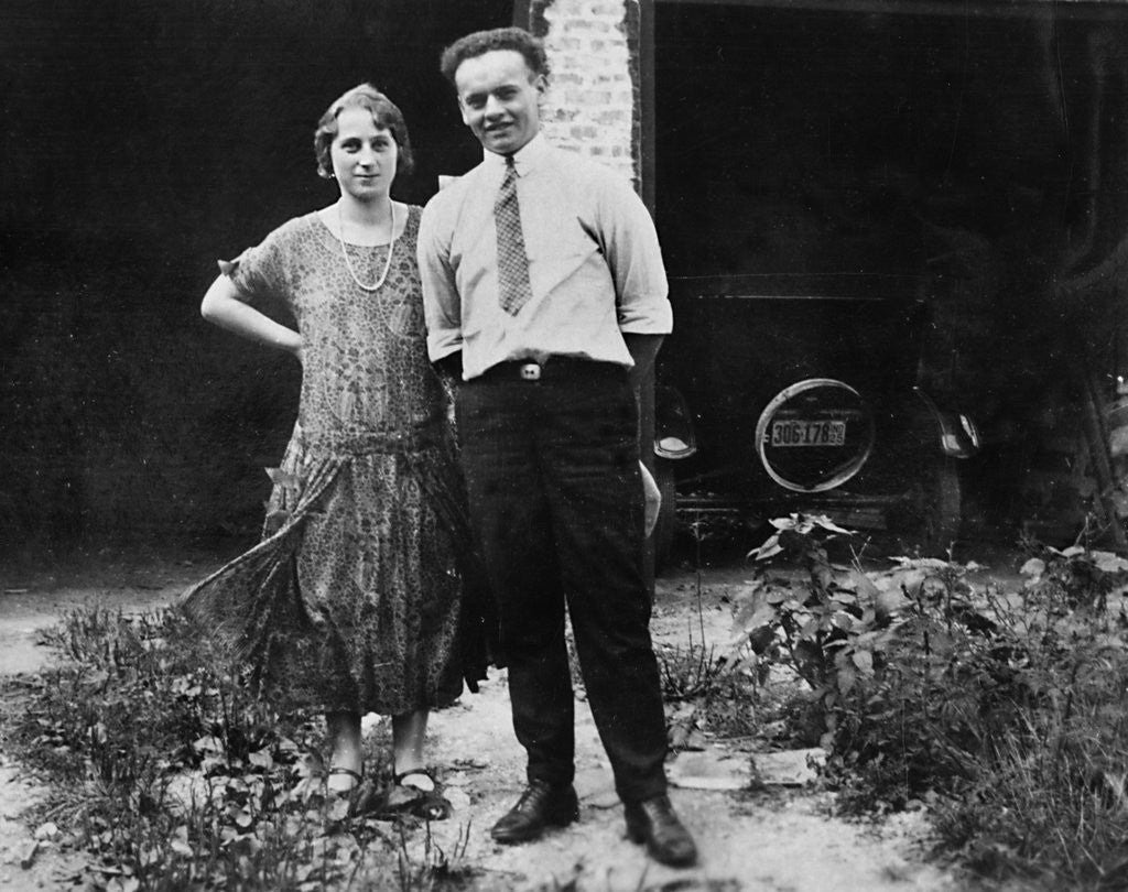 Detail of Young couple stands in front of their garage, ca. 1925 by Anonymous