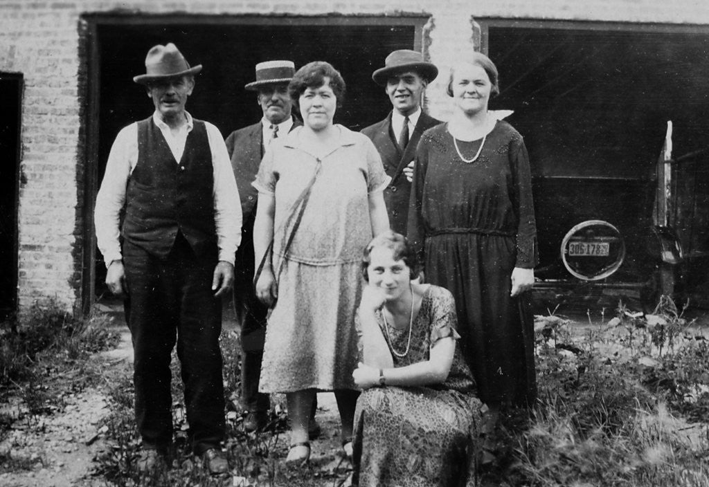 Detail of Family standing in front of garage, ca. 1925 by Anonymous