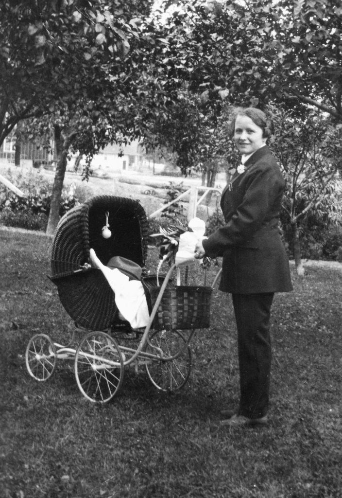 Detail of Woman in men's' clothes with a stroller at a baby shower, ca. 1924 by Anonymous