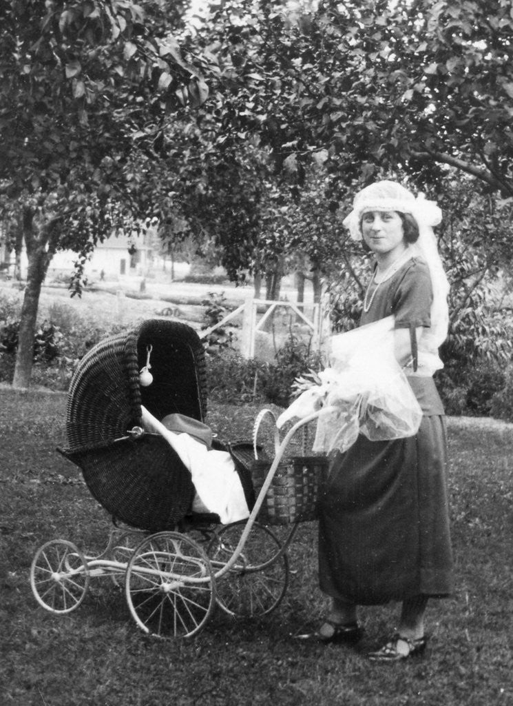 Detail of Mother to be with stroller at baby shower, ca. 1924 by Anonymous