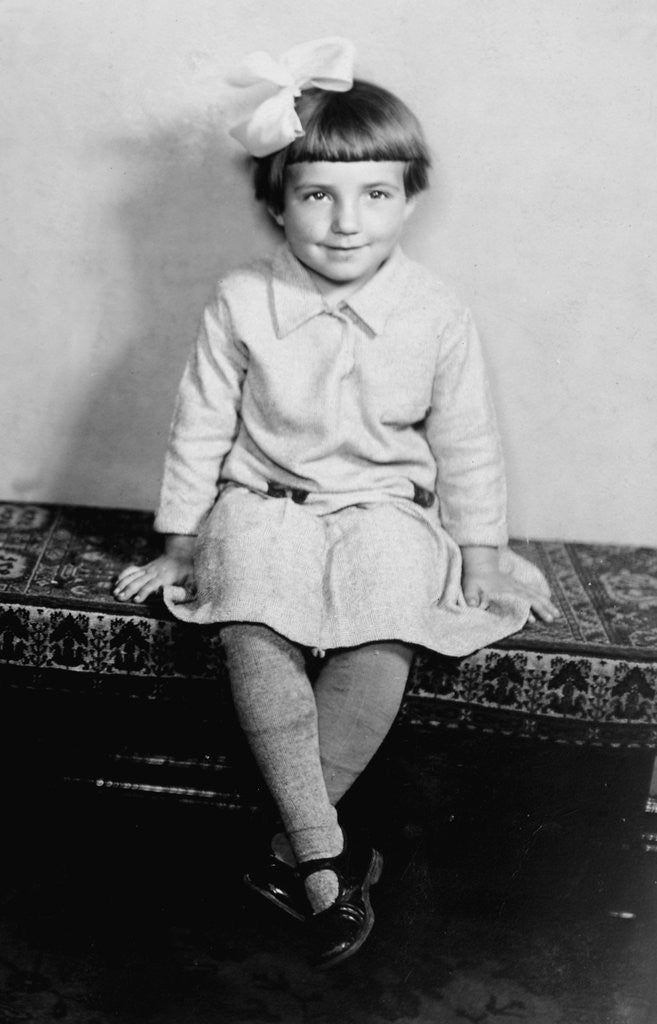 Detail of Young girl sits on a sofa, ca. 1933 by Anonymous