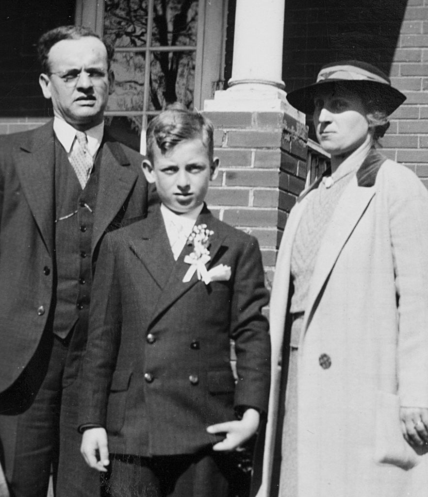 Detail of Young boy with his stern looking parents, ca. 1935 by Anonymous