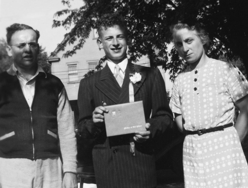 Detail of Boy with his parents on his 8th grade graduation, ca. 1940 by Anonymous