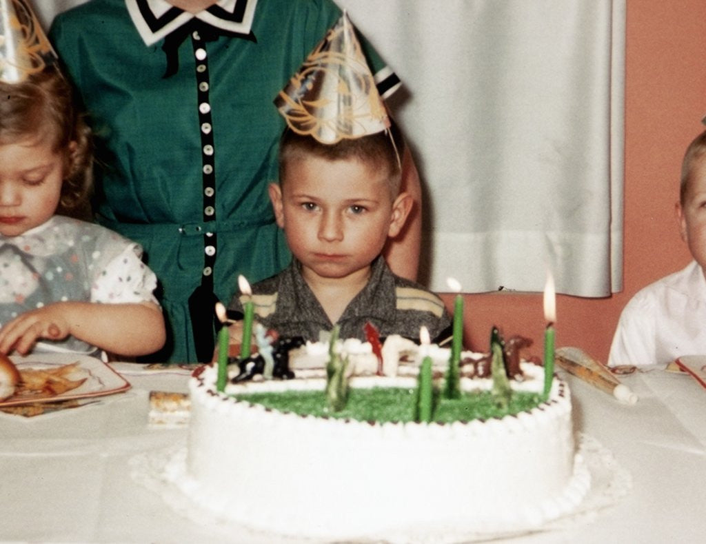 Detail of Grumpy boy at fifth birthday party, ca. 1957 by Anonymous