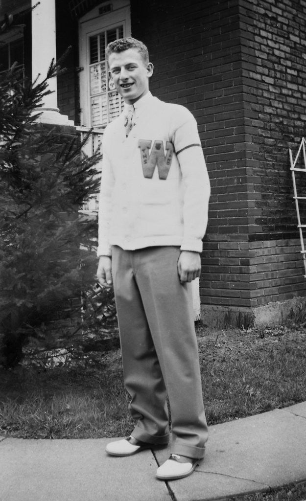 Detail of High school boy wearing his varsity sweater, ca. 1945 by Corbis