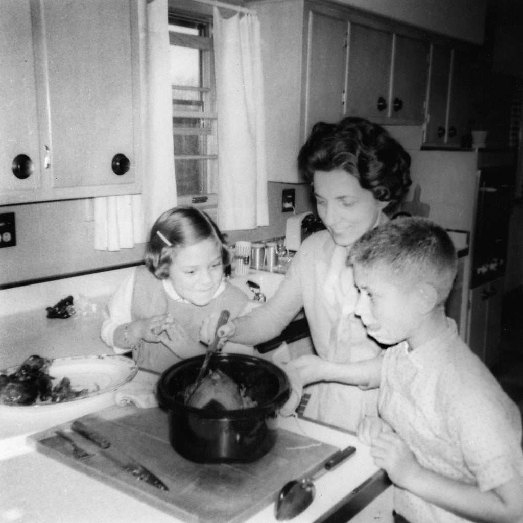 Detail of Mom prepares dinner with the kids watching, ca. 1962 by Anonymous