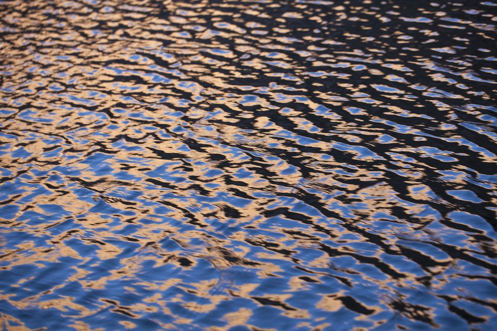 Detail of Reflection of red rock on Lake Powell at sunset by Anonymous
