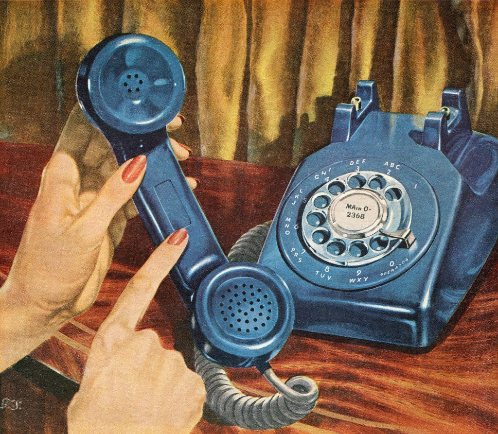 Hand holding blue rotary telephone receiver by Corbis