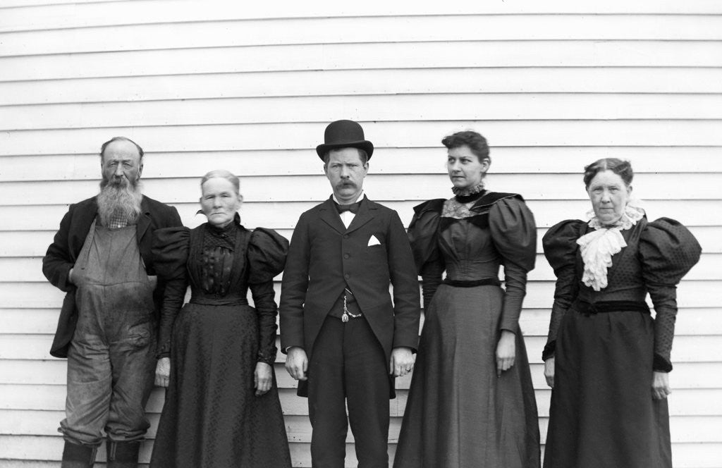 Detail of The family poses in their Sunday best, ca. 1900. by Corbis