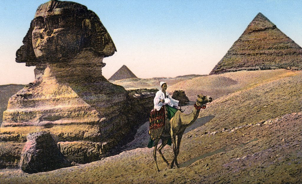 Detail of Man riding a camel in front of the Sphinx and pyramids by Anonymous