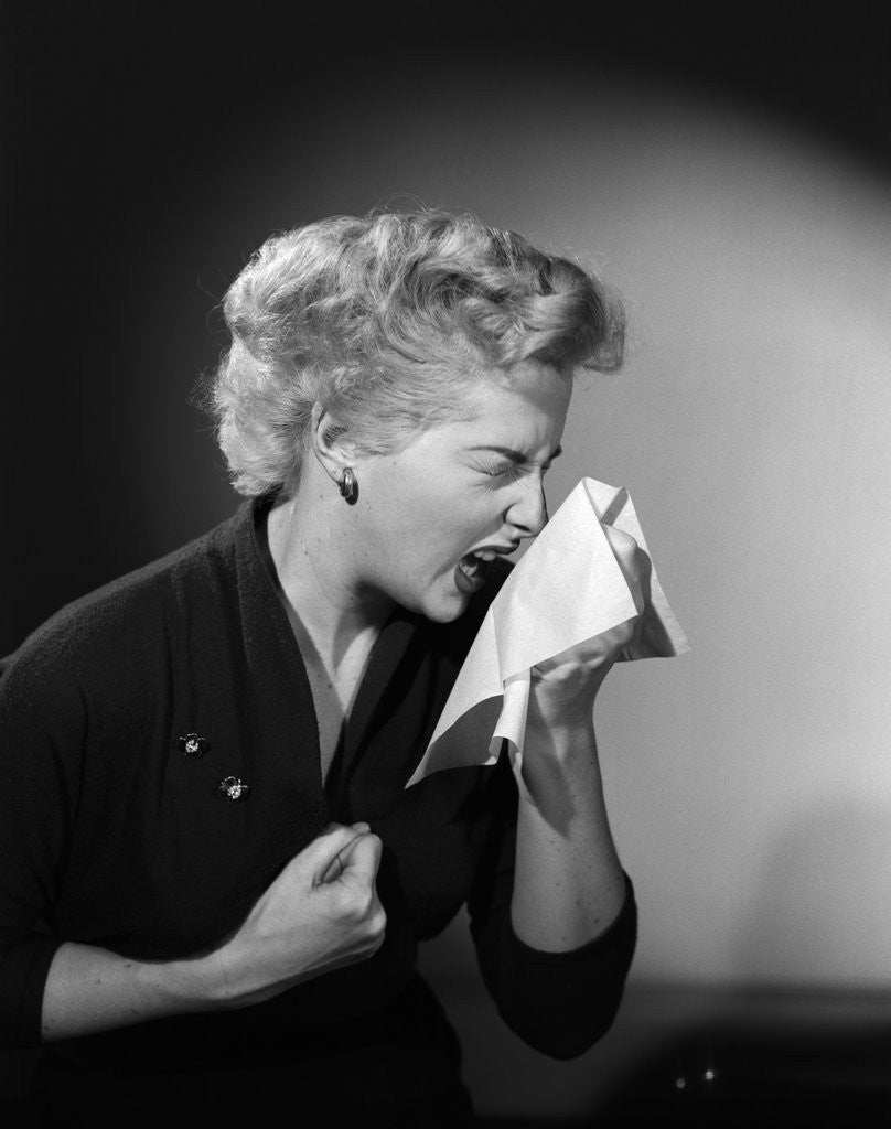 Detail of 1950s woman sneezing cold by Anonymous