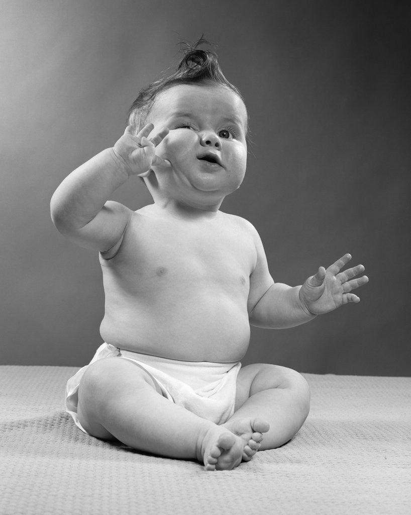 Detail of 1950s full figure baby sitting gesture hand touching cheek face expression funny by Anonymous