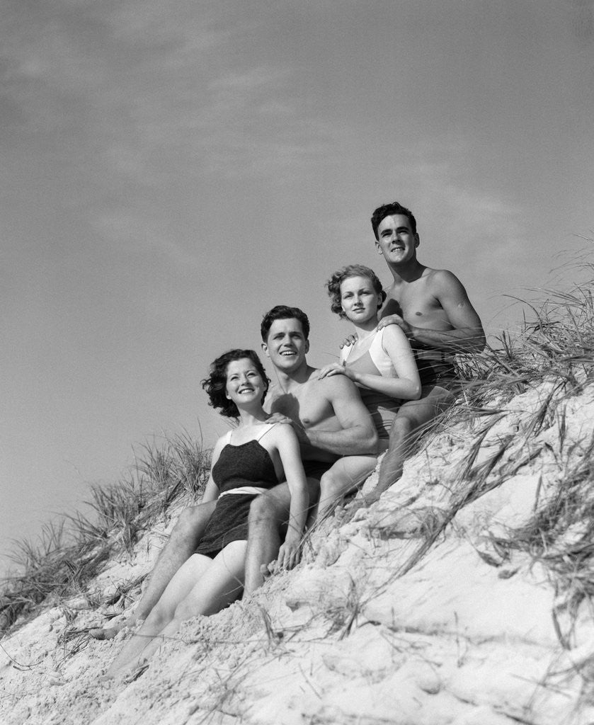 Detail of 1930s group young men women posed on beach sand dune by Anonymous