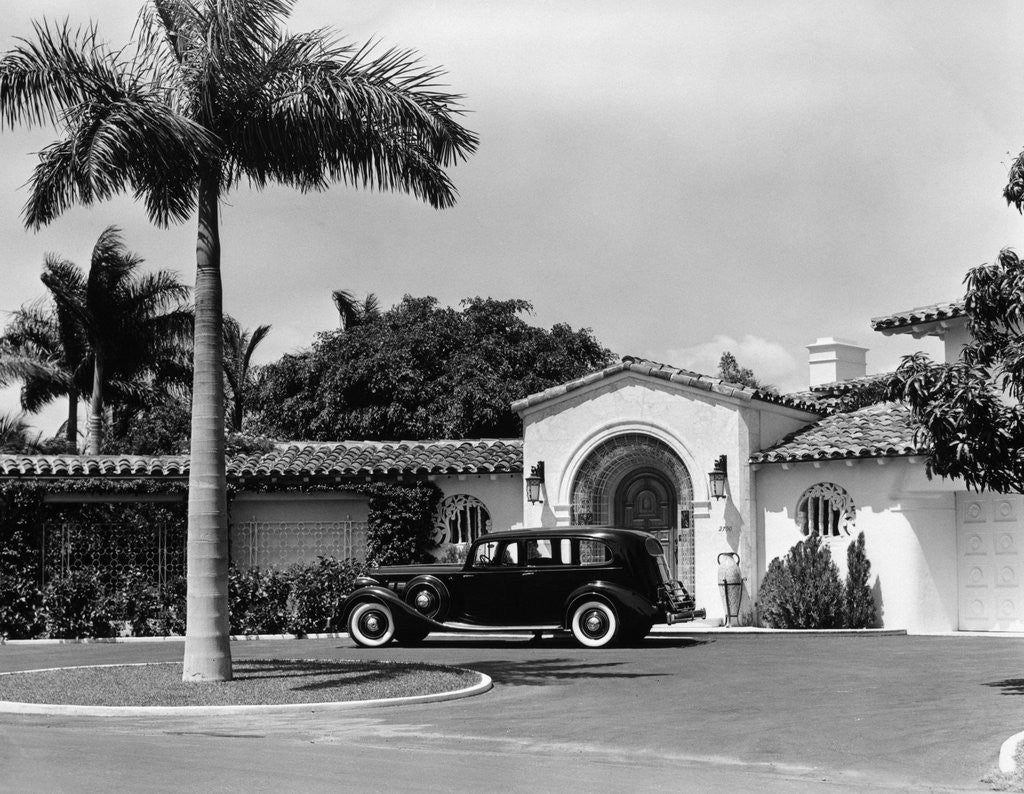 Detail of 1930s car in circular driveway of tropical stucco spanish style home in sunset islands miami beach florida usa by Anonymous