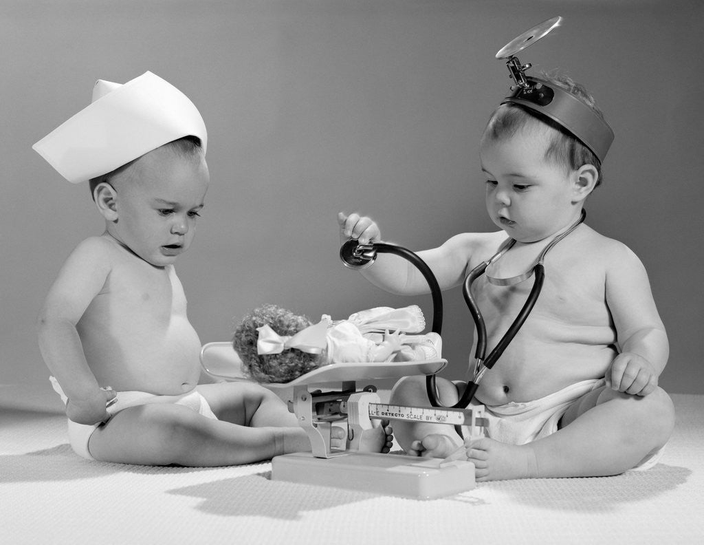 Detail of 1960s two babies playing doctor and nurse with doll studio by Anonymous