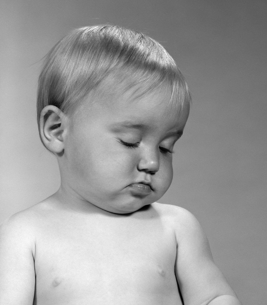 Detail of 1960s portrait baby nodding off to sleep by Anonymous