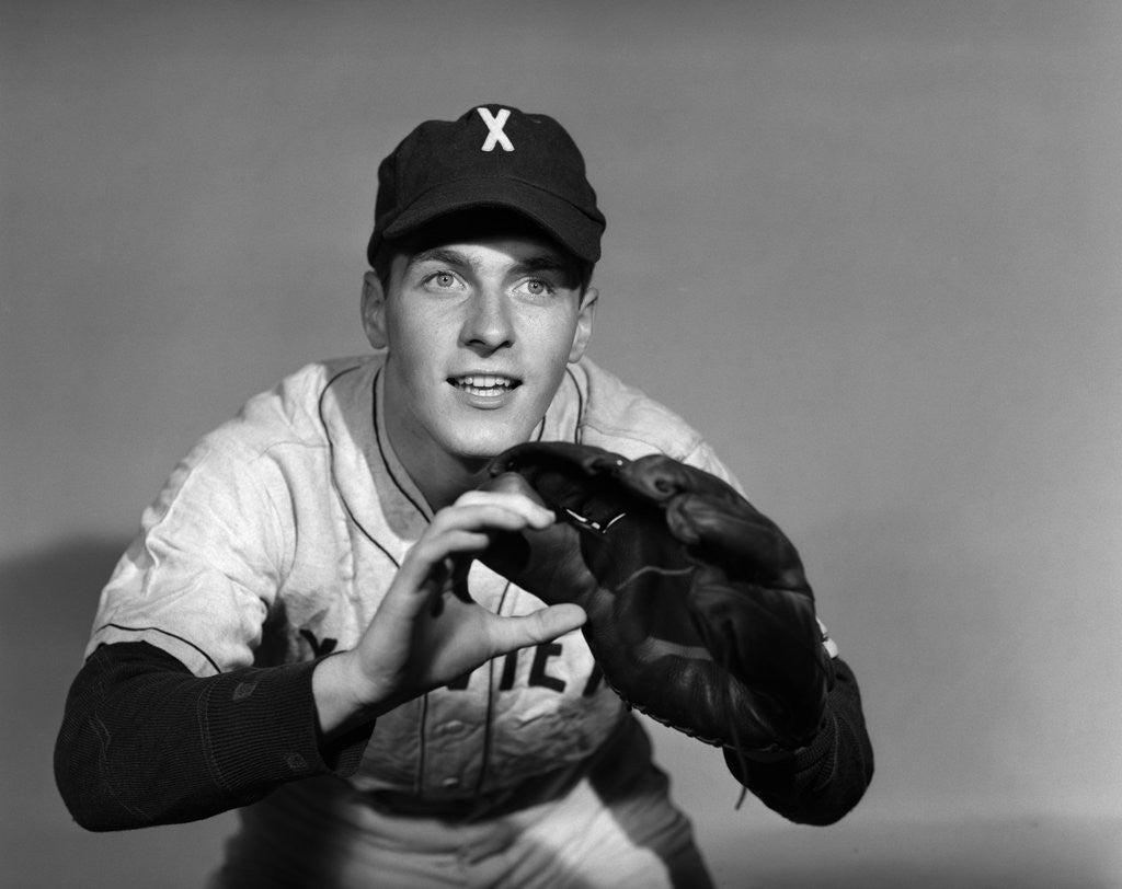 Detail of 1950s baseball player with glove poised to catch ball keeping his eye on the ball by Anonymous